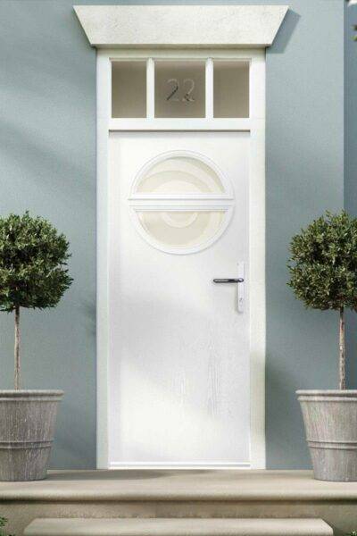 A Donaldson Doors external residential door between two topiary bushes